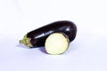 Whole and halved fresh eggplant on a white background, Aubergine Royalty Free Stock Photo