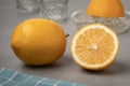 Whole and halved fresh Meyer lemon close up