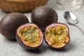 Whole and halved fresh tropical passion fruit close up