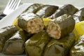 Whole and halved Greek dolmades on a plate Royalty Free Stock Photo