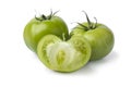 Whole and halved green unripe tomatoes Royalty Free Stock Photo