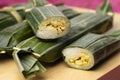 Whole and halved Lemper Ayam, an Indonesian savoury snack made of glutinous rice filled with seasoned shredded chicken Royalty Free Stock Photo