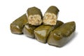 Whole and halved pieces of Greek dolmades on white background close up Royalty Free Stock Photo