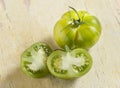 Whole and halved tiger tomatoes