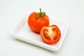 Whole and halved tomatoes Royalty Free Stock Photo