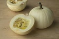 Whole and halved white Lumina pumpkins Royalty Free Stock Photo