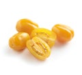 Whole and halved yellow cherry tomatoes Royalty Free Stock Photo