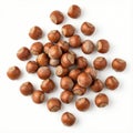 loose handful of whole hazelnuts in shell spread out over the white background Royalty Free Stock Photo