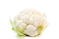 Whole head of fresh white raw cauliflower with leaves close-up on white background. Isolated on white background Royalty Free Stock Photo