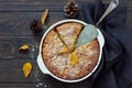 Whole homemade apple pie on dark wooden background