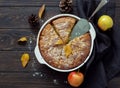 Whole homemade apple pie on dark wooden background