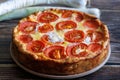 Whole homemade leek quiche for branch. German Leek Cake on a wooden table. Close up