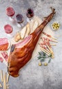 Whole leg HAM JAMON SERRANO and red and rose wine on gray background. Top view. Flat lay Royalty Free Stock Photo