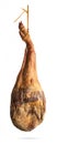 Whole leg of Spanish Iberian serrano ham hanging on a rope. Royalty Free Stock Photo