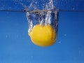 Whole lemon dropped in water