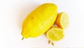 Whole lemon and lemon halves with seeds isolated on white