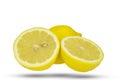 Whole lemon and two half slices. Royalty Free Stock Photo