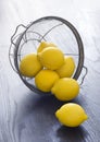 Whole Lemons Spill Out of Colander