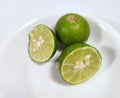 Whole lime with cut in half lime isolated on a white background Royalty Free Stock Photo