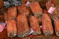 Whole lonzi in close-up on a market stall in Corsica