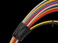 Whole lot of colorful cables bound together with black rubber