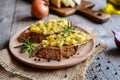 Whole meal bread slices with scrambled eggs, cheese and onion