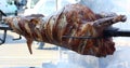 Whole meat roasting on a spit Royalty Free Stock Photo