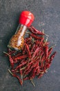 Whole and milled red chili peppers. Top view