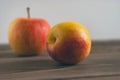 A Whole Nectarine Fruit, Peach with Smooth Skin of the Family Rosaceae and a Red Apple on Rustic Wooden Table. Fruit Salad