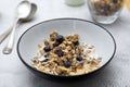 Whole oats breakfast, granola with dried fruit and blueberry, milk and honey. Healthy food, clean eating. Copy space Royalty Free Stock Photo