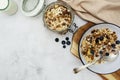 Whole oats breakfast, granola with dried fruit and blueberry, milk and honey. Healthy food, clean eating. Copy space Royalty Free Stock Photo