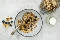 Whole oats breakfast, granola with dried fruit and blueberry, milk and honey. Healthy food, clean eating. Copy space Royalty Free Stock Photo