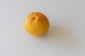 Whole orange isolated on white background makes a shadow. Flatlay photo Royalty Free Stock Photo