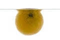 A whole orange thrown into the water. View from under the water Royalty Free Stock Photo