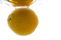 A whole orange thrown into the water. View from under the water Royalty Free Stock Photo