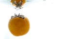A whole orange thrown into the water. View from under the water Royalty Free Stock Photo