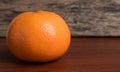 Whole orange on a wooden table