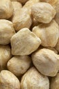 Whole peeled kukui nuts close up
