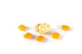 Whole pieces and chewed orange bubble gum isolated over white