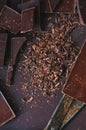 Whole and pieces of dark chocolate bars on a darkbackground at Royalty Free Stock Photo
