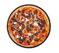 Whole pizza with cherry tomatoes, spinach, mozzarella, feta, kalamata olive and mushrooms on round slate platter, isolated Royalty Free Stock Photo