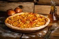 Whole pizza with chicken, onion and corn