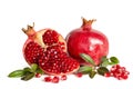 Whole Pomegranate and two parts of Pomegranate with leaves and seeds on white Royalty Free Stock Photo