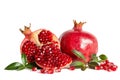 Whole Pomegranate and two parts of Pomegranate with leaves Royalty Free Stock Photo