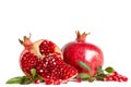 Whole Pomegranate and two parts of Pomegranate with leaves Royalty Free Stock Photo