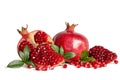 Whole Pomegranates and three part of Pomegranate with leaves Royalty Free Stock Photo