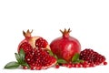 Whole Pomegranates and three parts of Pomegranate with leaves Royalty Free Stock Photo