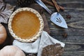 Whole Pumpkin Pie over Rustic Wood Background Royalty Free Stock Photo