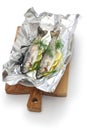 Whole rainbow trout baked in foil (before oven baking).