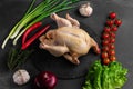 Whole raw chicken meat on a wooden cutting board top view Royalty Free Stock Photo